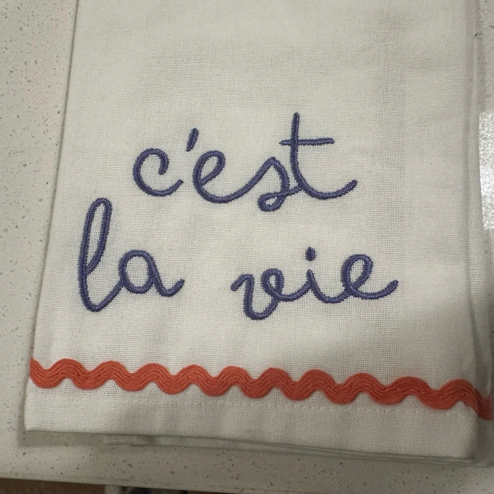 Embroidered Tea Towel with Lavender Writing and Pinkish Trim